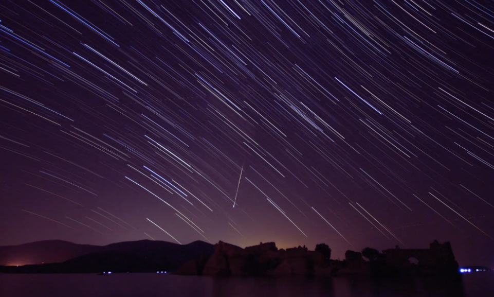 A rare celestial spectacle combines a meteor shower, fireballs, and a comet in the pre-dawn sky
